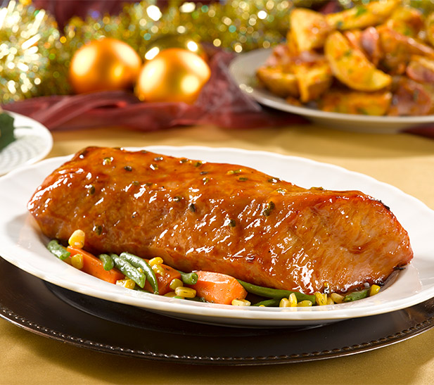 Lomo de cerdo horneado glaseado con duraznos y maracuyá