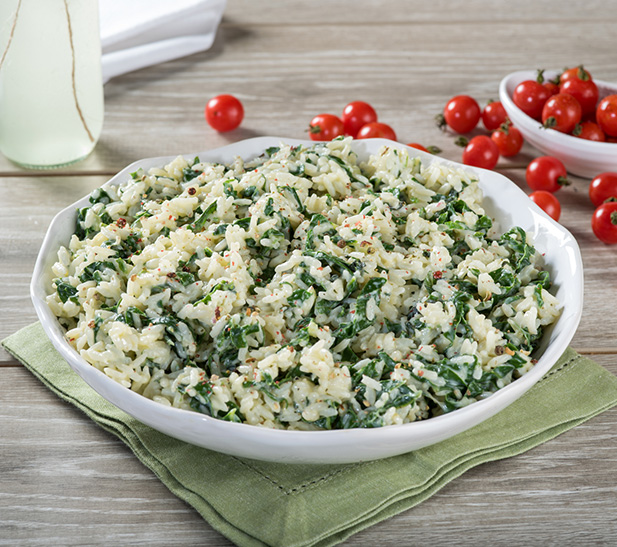 Arroz cremoso con hojas verdes